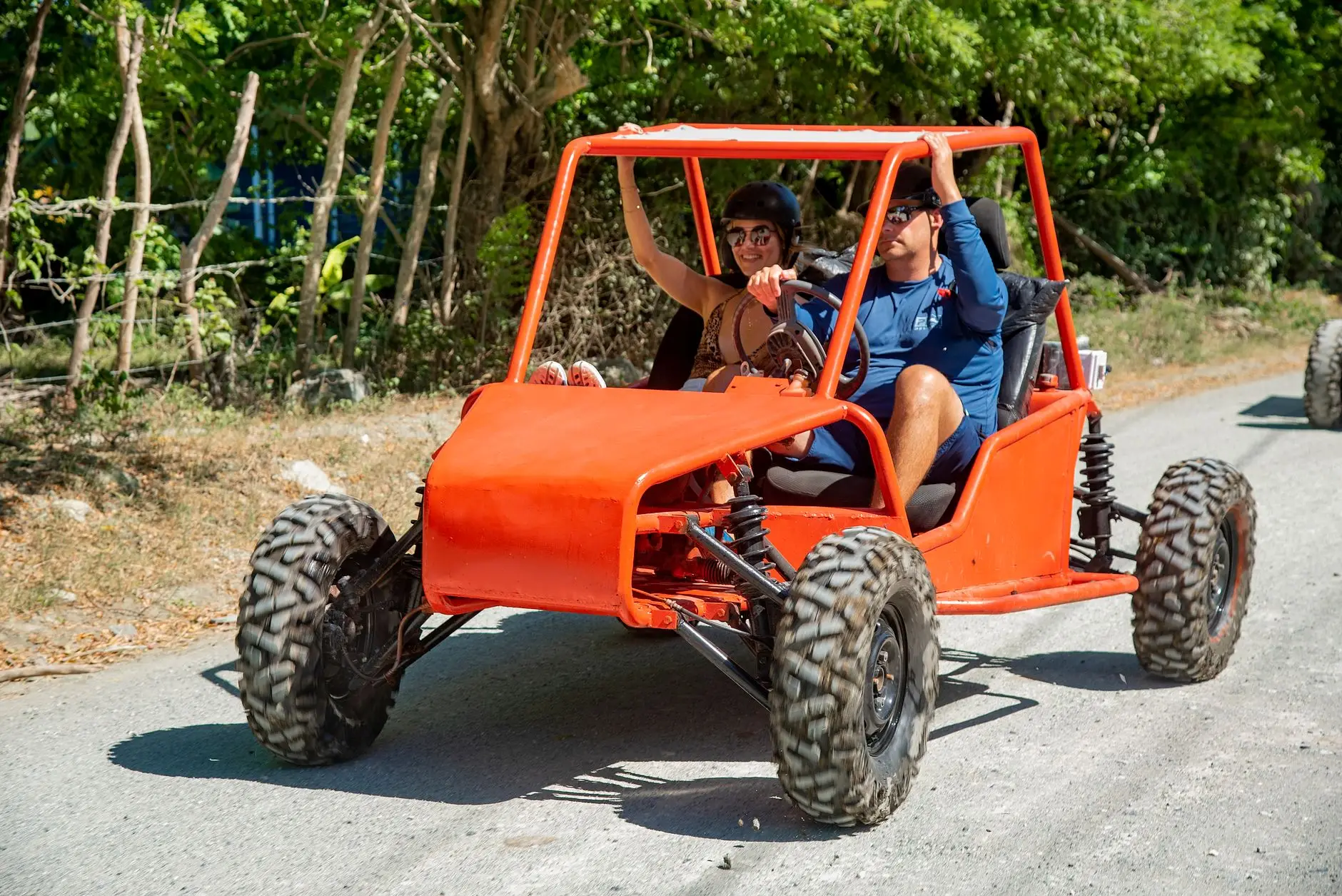 Tandem UTV buggy tour in Bali's rugged terrain.